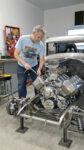 01 Tom Keyes doing some final tightening of the M_T valve covers on the early Chrysler 354 Hemi