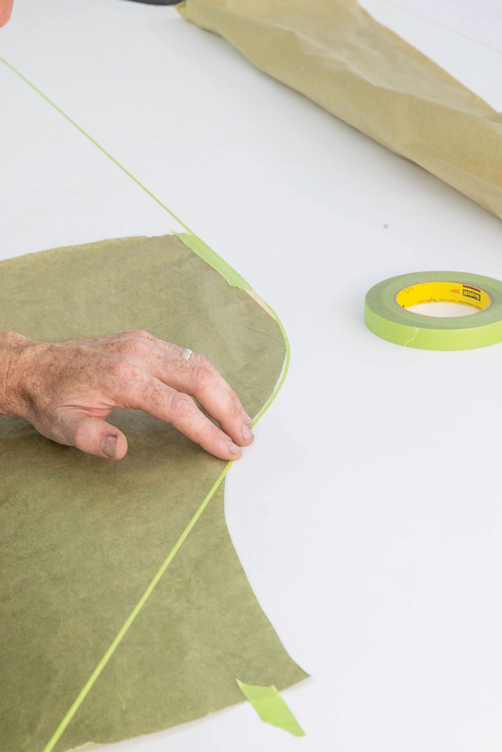 11 The shape is transferred to the masking paper using fine line tape