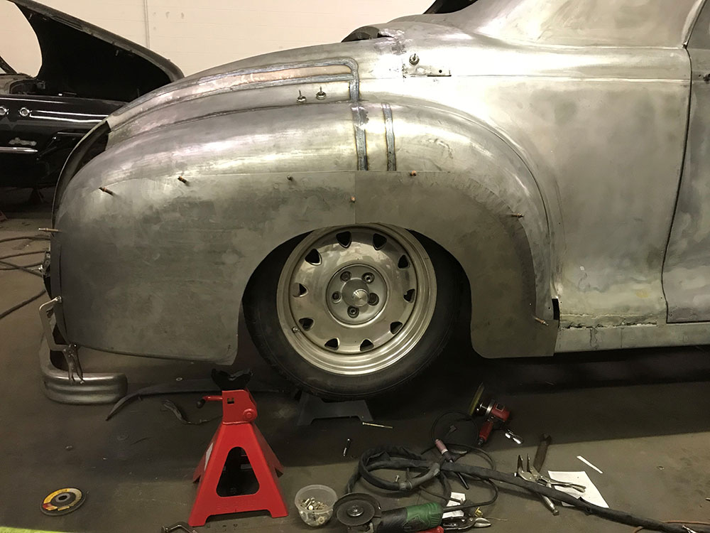 08 1947 Dodge custom shaping fender and bustle in sections, then welds ground and planished