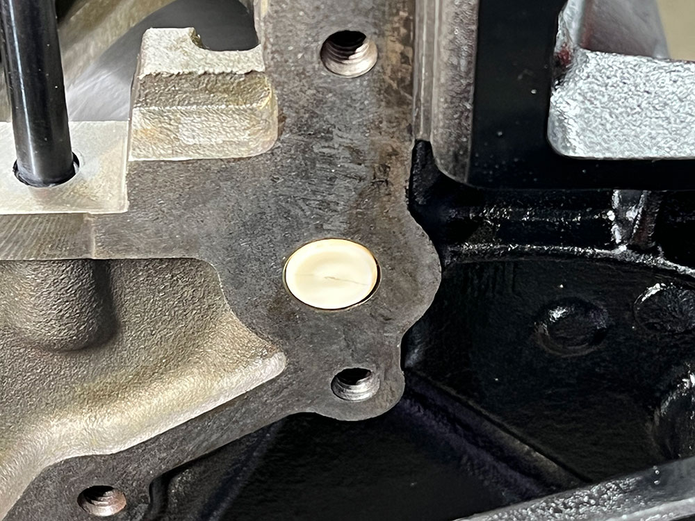 14 Properly installed the barbell sits flush with the engine block