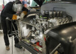 001 A sturdy support is needed to cradle the radiator core and tie the tops of the front fenders together
