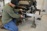 01 Colin Radford does a test fit of a pair of Strange Engineering coilovers on the Art Morrison Enterprises Bikini Clip
