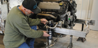 01 Colin Radford does a test fit of a pair of Strange Engineering coilovers on the Art Morrison Enterprises Bikini Clip