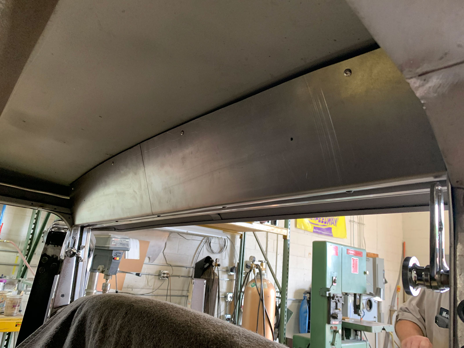 16 After measuring and trimming a piece of sheet metal to size the overhead dash is mocked up on its custom mounts