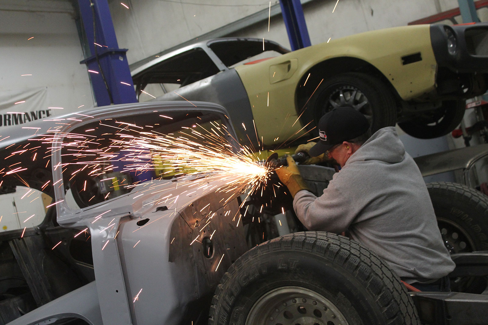 04 Sparks flying as a cut off disc is used for metalwork in a 55 Chevrolet