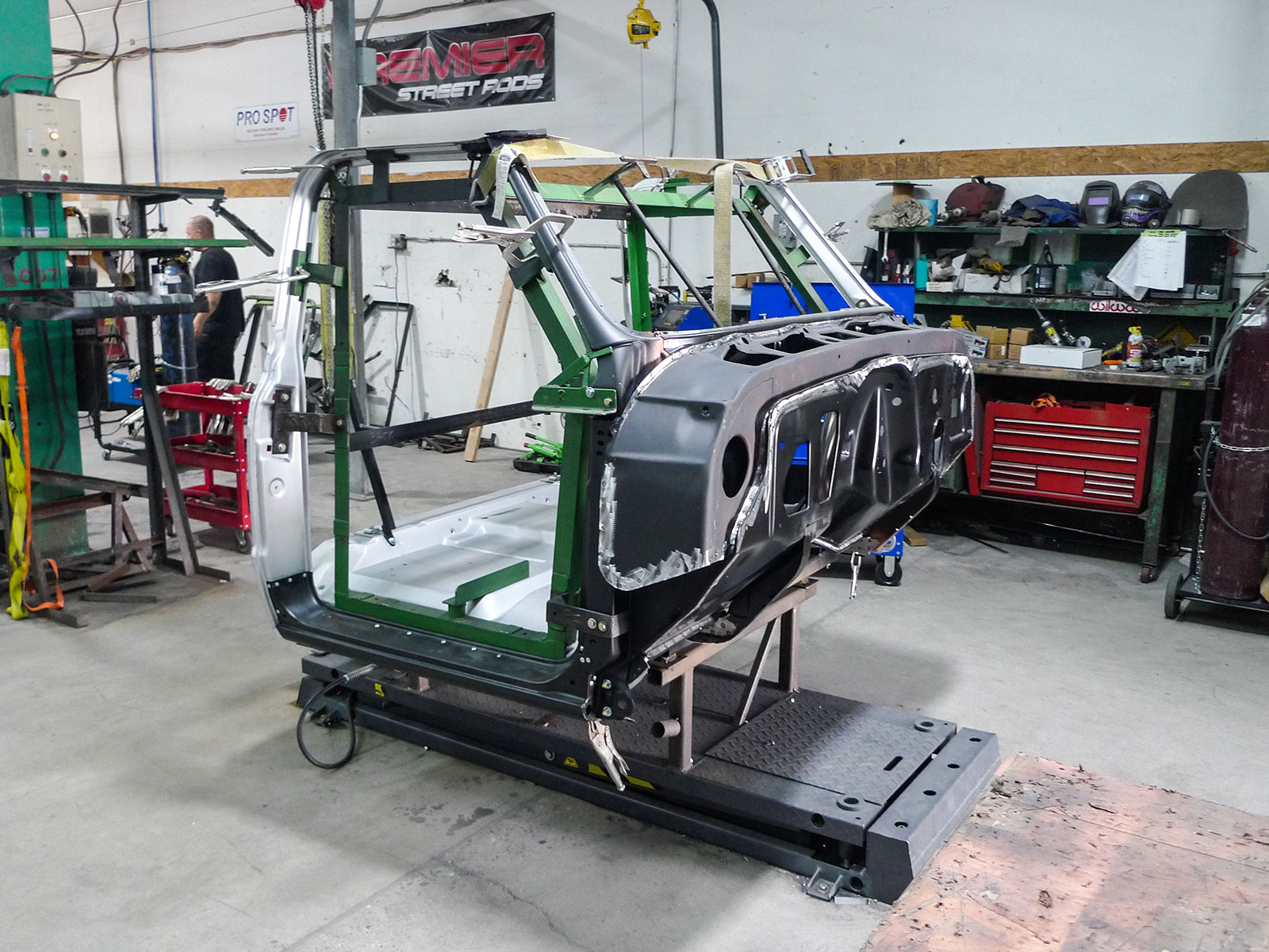 08 a 67 72 Chevy cab being assembled on a specific purpose fixture at Premier Street Rod