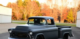 01 Matte black 1955 Chevy truck front three quarter view lowered stance