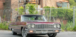 001 Vintage maroon Chevrolet Impala with custom wheels front view