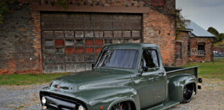 01 Olive green 1954 Ford F100 with custom black wheels side view