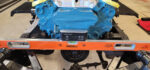 01 a level car supported by jack stands during the chassis repair process