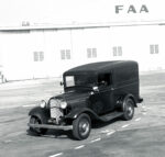 01 Vintage 1932 Ford panel truck photographed by Tex Smith in front of Howard Hughes Santa Monica airport hangar showcasing the history of classic automobiles