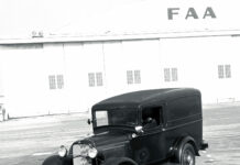 01 Vintage 1932 Ford panel truck photographed by Tex Smith in front of Howard Hughes Santa Monica airport hangar showcasing the history of classic automobiles