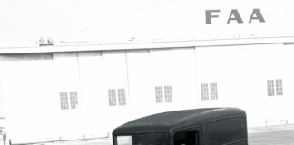 01 Vintage 1932 Ford panel truck photographed by Tex Smith in front of Howard Hughes Santa Monica airport hangar showcasing the history of classic automobiles