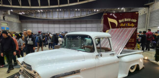 01 White classic Chevrolet truck with chrome accents displayed at a truck show