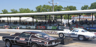 001 1970s Chevrolet Camaro Brief Encounter drag racing a white Corvette