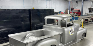 01 1950 Chevrolet 3100 undergoing restoration in a workshop showing raw metal bodywork