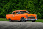 001 Bright orange 1955 Chevy Bel Air with a large blower front view on a sunny day