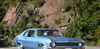 001 Light blue 1969 Chevy Nova parked near a rocky cliffside