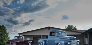 001 Two 1950 Ford F 1 trucks blue and maroon