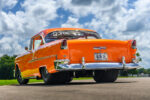 005 Detailed view of the supercharged engine in a 1955 Chevy Bel Air with chrome accents