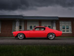 007 Side profile of the 1970 Camaro Z28 against a brick building backdrop
