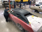 01 Bob Stedman meticulously working on a large surface area of a car