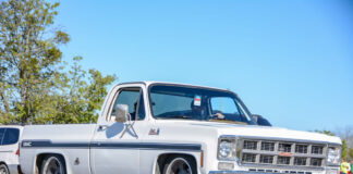 001 Lowered white GMC truck 1970s era with custom wheels