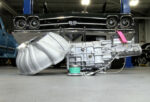 000 Tremec transmission and bellhousing in front of a 1969 Chevrolet Chevelle SS 396