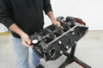 000 inspecting a disassembled engine block using a dial indicator