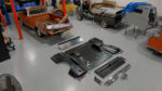 04 Aerial view of a 1967 1972 GMC truck with parts laid out for restoration in a workshop