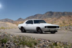 01 1969 Camaro Z28 with a modern pro touring look finished in sleek white with black accents and red trimmed wheels