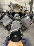 01 Front view of a BluePrint engine block with a large throttle body and braided fuel lines