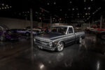 1 Museum exhibit featuring a lowered 1968 Chevrolet C10 with a modern stance and matte finish