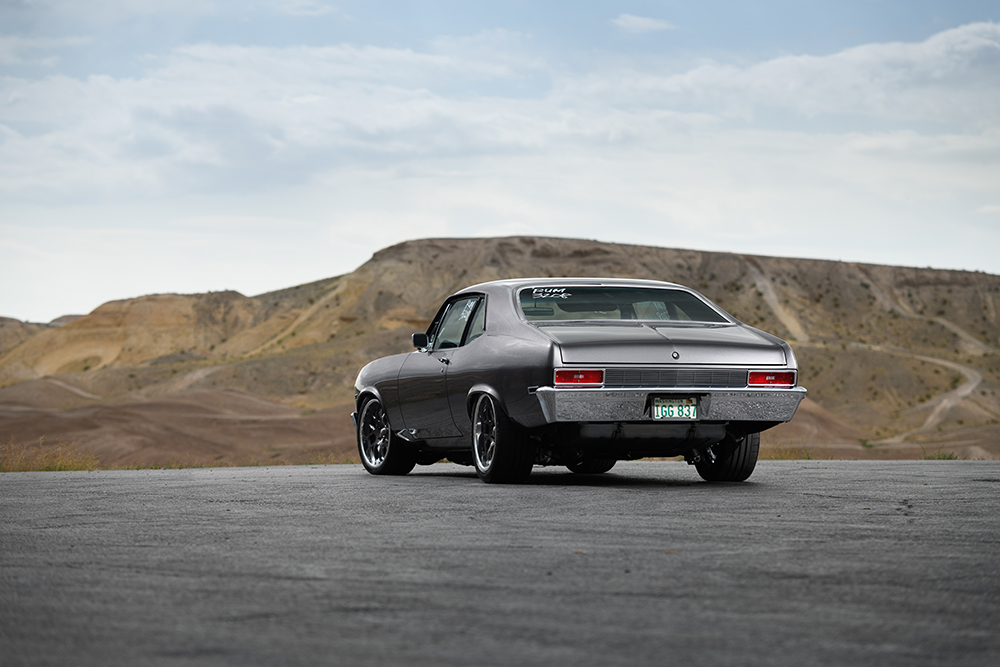 003 Front view of a 1971 Chevrolet Nova featuring a custom front grille hood stripes and aggressive stance