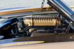 008 Detailed side view of hood struts and custom components under the hood of a 1969 Chevy Camaro