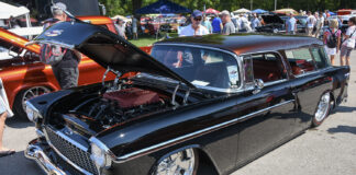01 1955 Chevrolet Nomad with a modernized engine bay and chrome accents featuring a stunning black finish at Tri Five Nationals