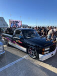 01 Customized 1988 98 Chevrolet CK truck with retro graphics and chrome wheels showcased at the Triple Crown Truck Show