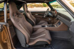 010 Interior view of 1969 Chevy Camaro featuring modern dashboard custom center console and brown leather upholstery