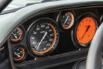 011 Custom gauge cluster in 1969 Camaro with Illicit branding featuring speedometer boost and tachometer