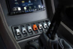 013 Close up of modern toggle switches and infotainment system in a 1969 Camaro interior