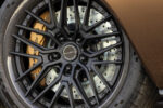 017 Matte black custom wheels with carbon fiber accents and gold Brembo brakes on a 1969 Camaro