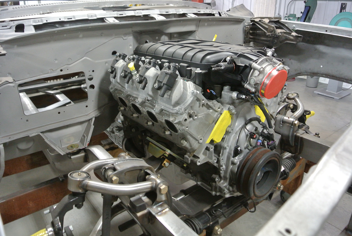 02 Side view of the 1959 Chevy's engine installation showing front suspension components in raw fabrication