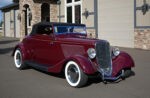 03 1933 Ford Cabriolet three quarter front view showcasing flared fenders split windshield and chrome hood vents