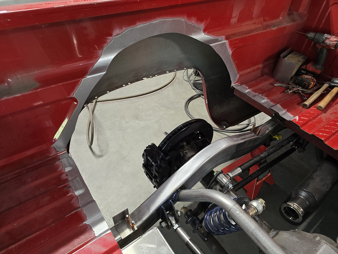 03 Fabrication on inner fender area for tire clearance in Chevy OBS truck bed