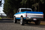03 Front view of 1972 Chevy K10 showcasing classic chrome grille dual headlights and vibrant blue and white color scheme