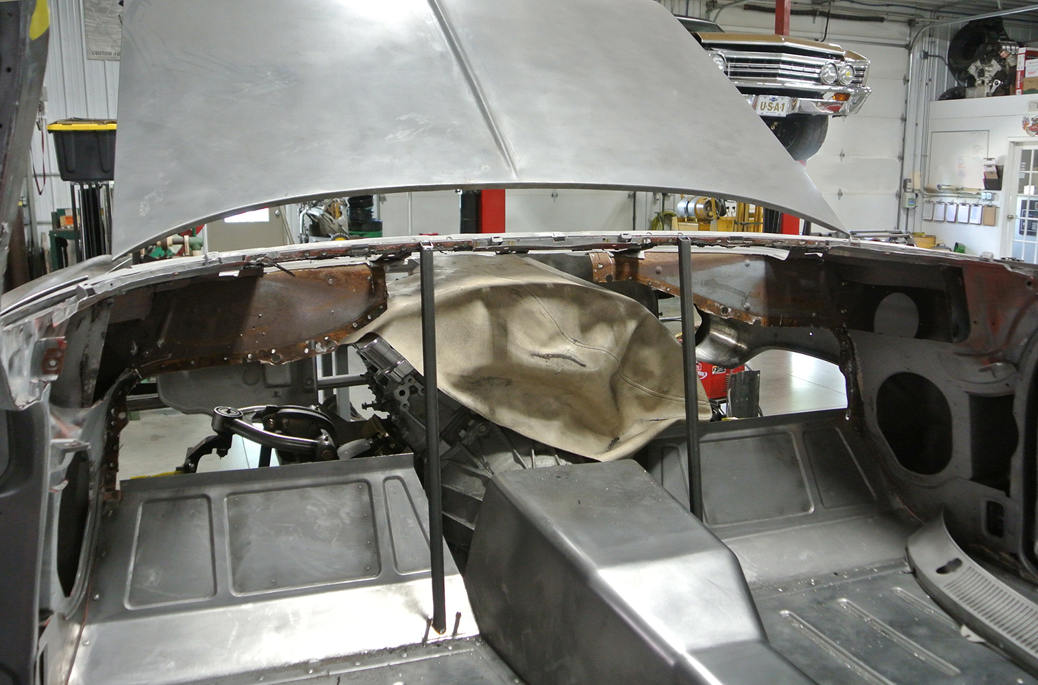 03 Interior firewall of the 1959 Chevrolet prepped and modified to fit the new transmission setup