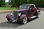 05 1933 Ford Cabriolet front angle featuring Ford V8 emblem chrome grille surround and wide whitewall tires