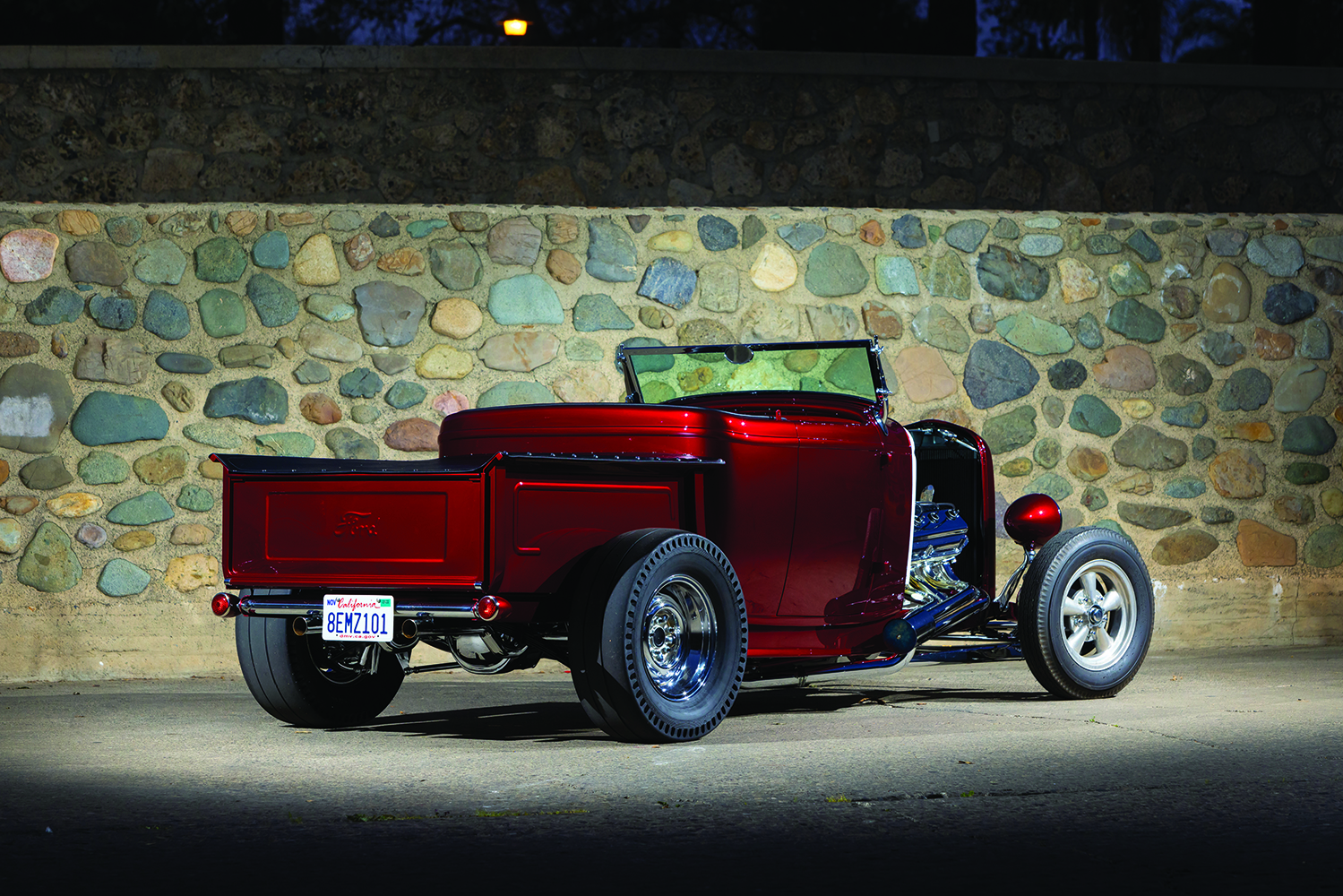 05 Side profile of a custom 1932 Ford Roadster pickup emphasizing its low stance and custom wheels