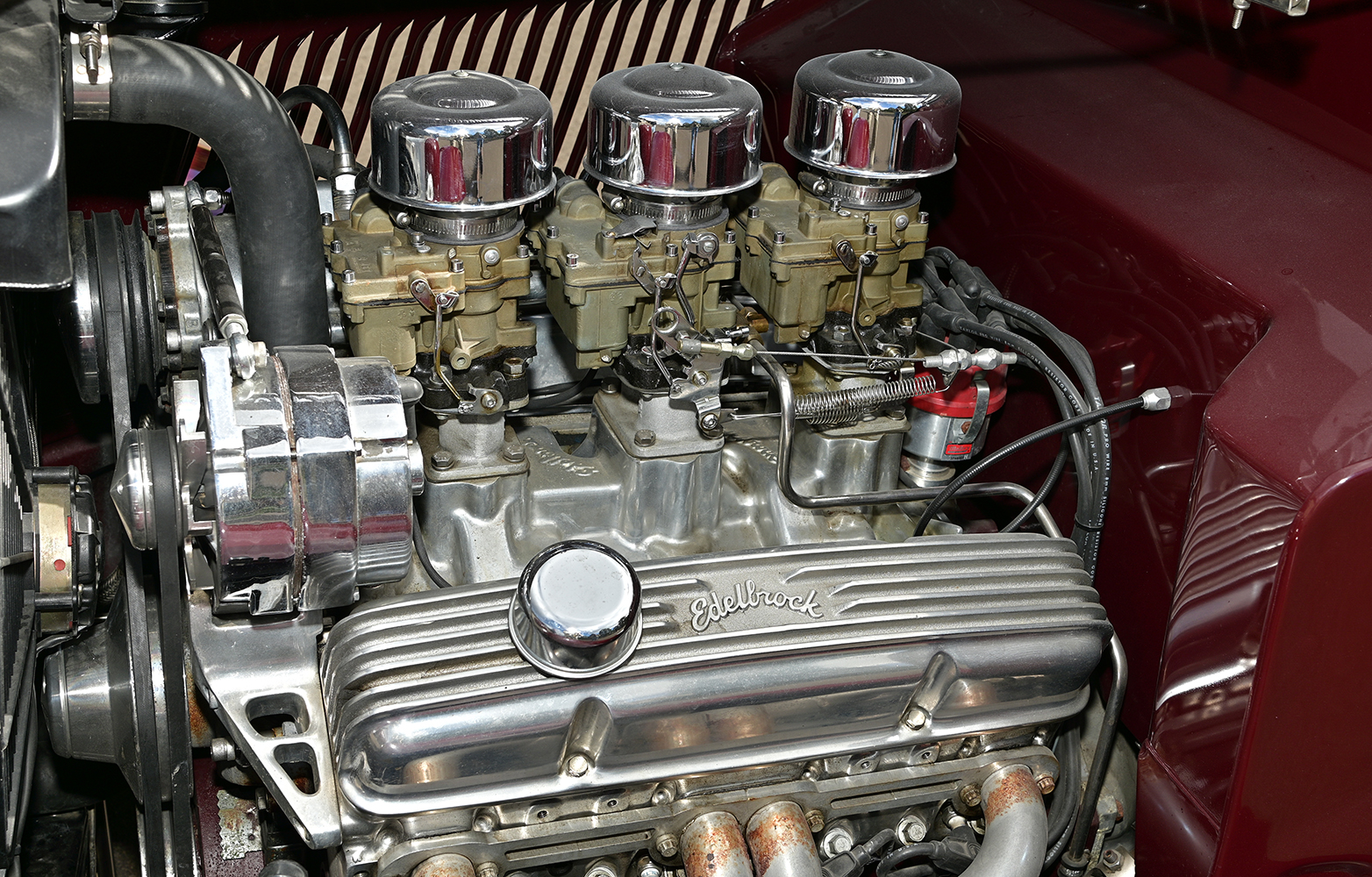 06 1933 Ford Cabriolet engine bay with triple Stromberg carburetors Edelbrock intake manifold and polished valve covers