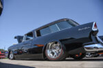 06 1955 Chevrolet Nomad in gloss black lowered stance with red line tires and polished wheels for a sleek show finish
